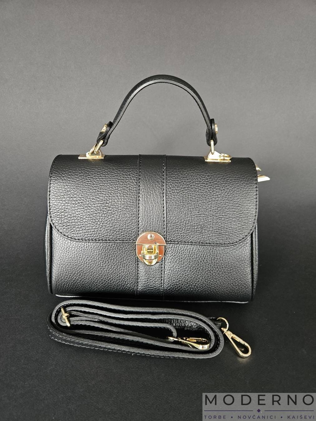 Moderna Ženska torba “Keti” Crna od prirodne kože sa zlatnom kopčom i kaišem Moderna Ženska torba “Keti” Crna od prirodne kože sa zlatnom kopčom i kaišem